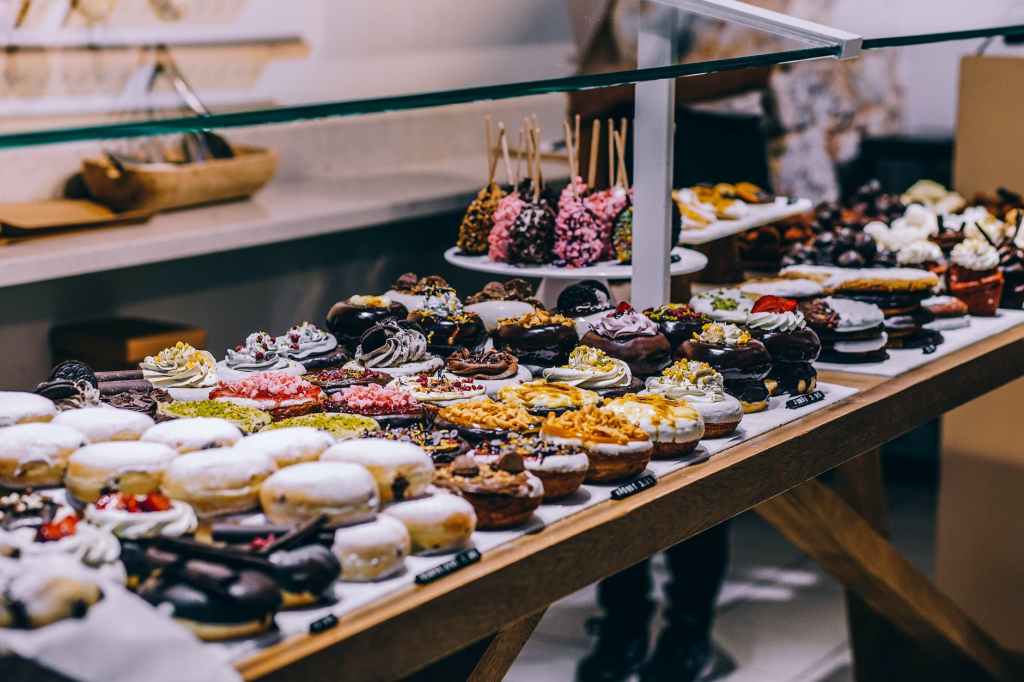 donuts and bagel display in a store
