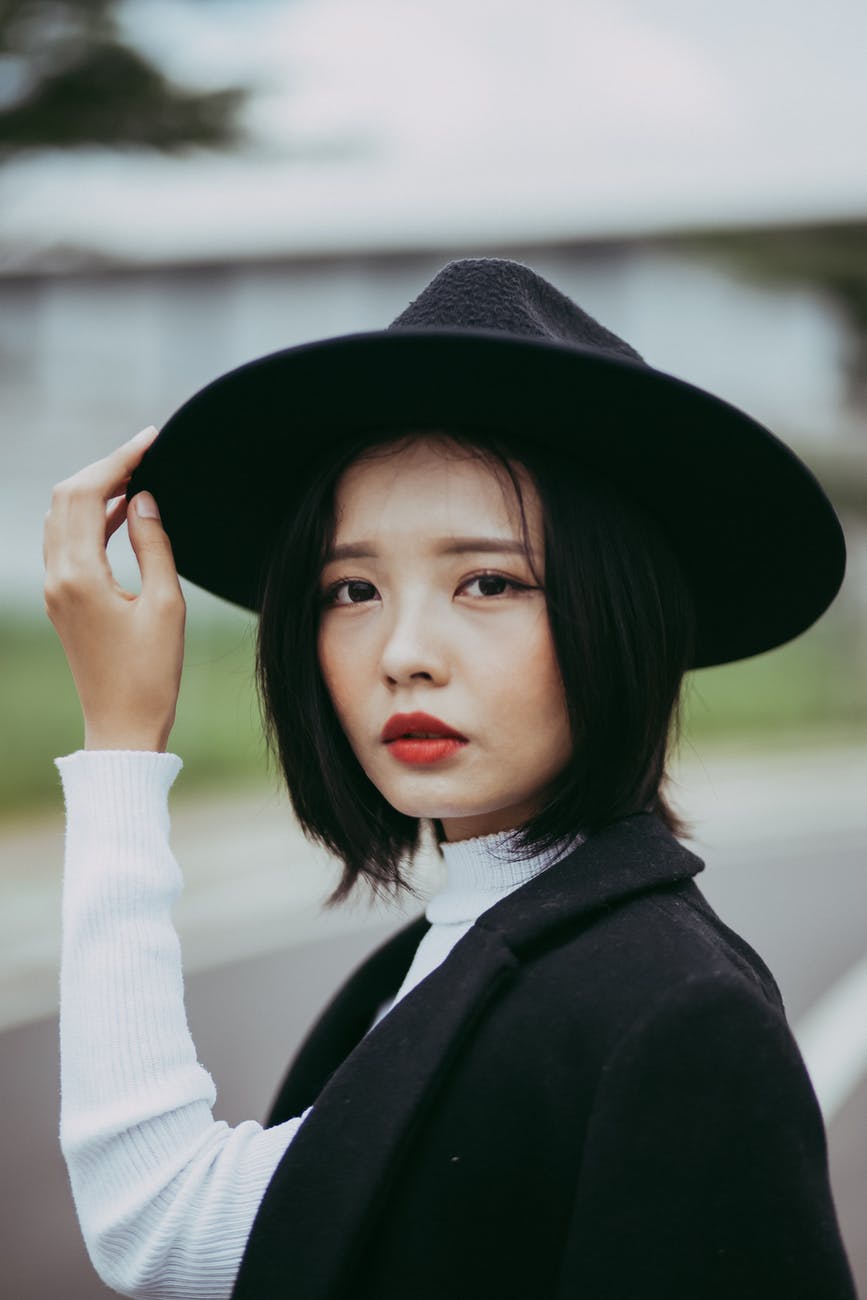 woman in black hat