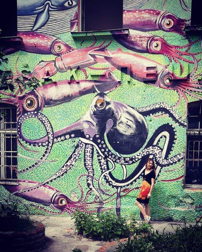 Octopus graffiti on a green wall